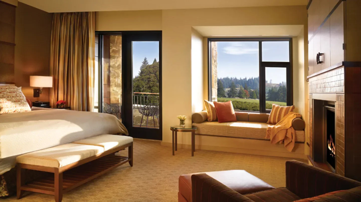 Cozy bedroom at The Allison Inn & Spa in Portland with a scenic view.