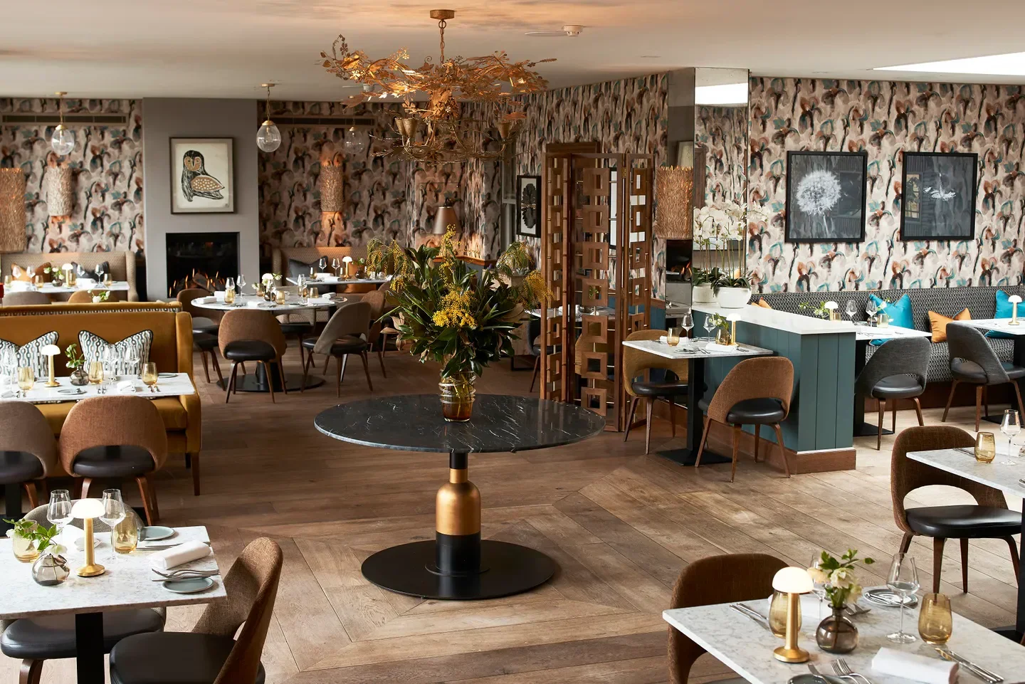Interior of The Back Garden Restaurant in the Cotswolds, featuring stylish decor and dining tables.