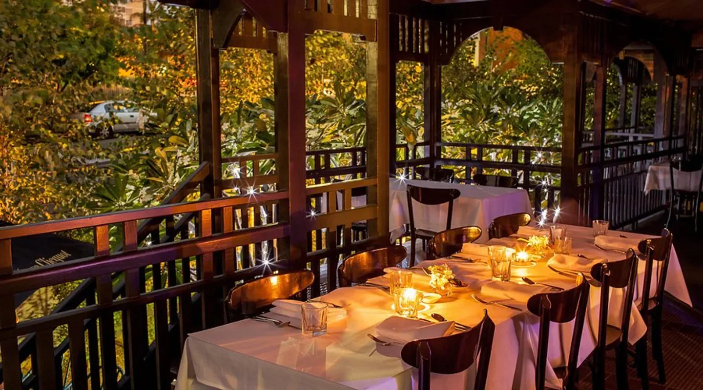 Romantic outdoor dining at The Balfour Kitchen & Bar in Brisbane with candlelit tables.