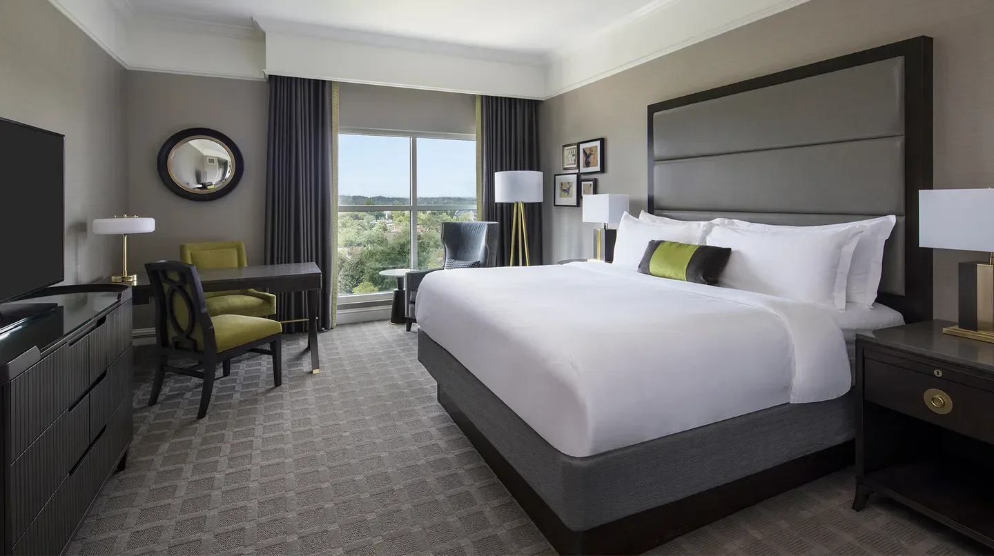 Luxury bedroom at The Ballantyne, A Luxury Collection Hotel in Charlotte, with city views.