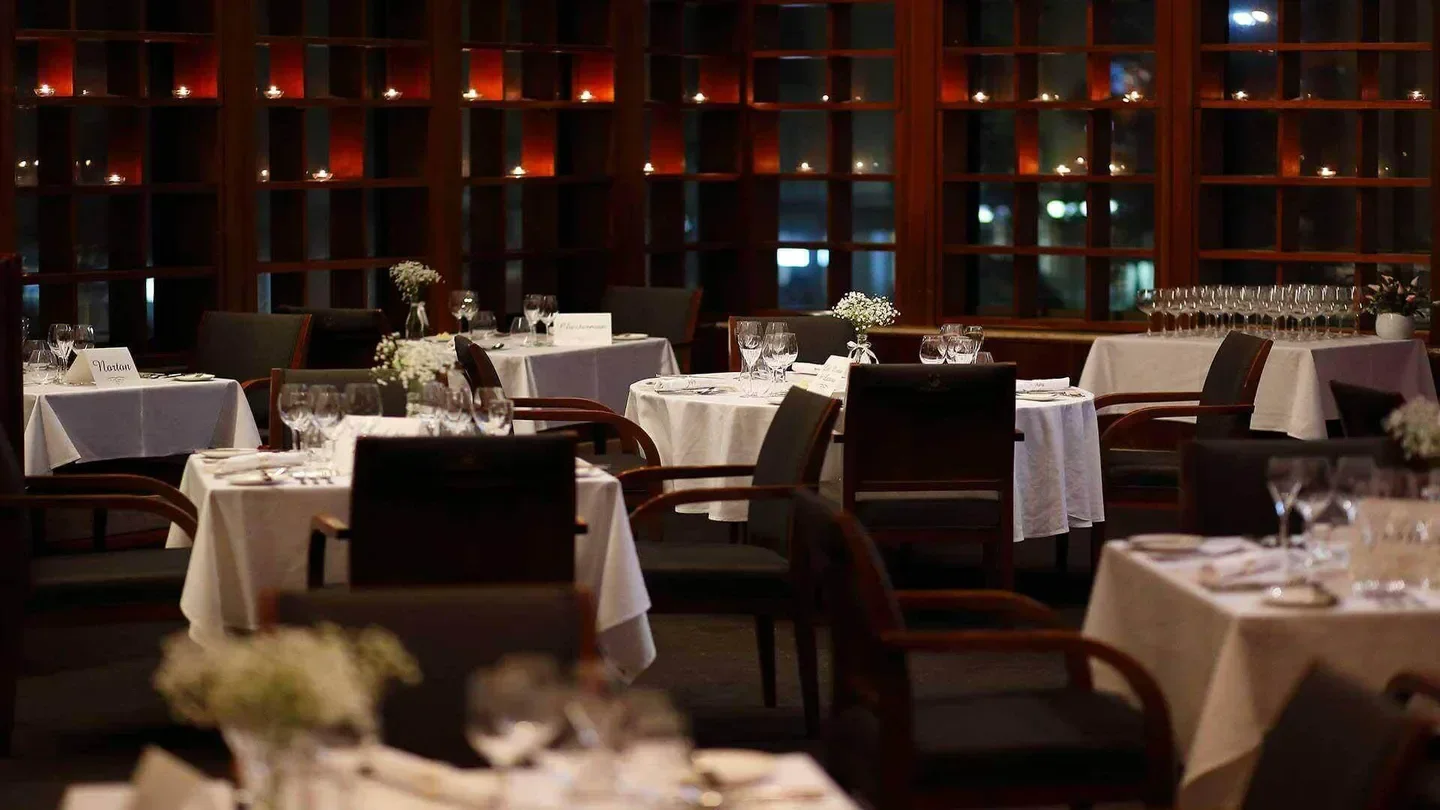 Elegant dining room at The Brisbane Club restaurant in Brisbane, set for service.