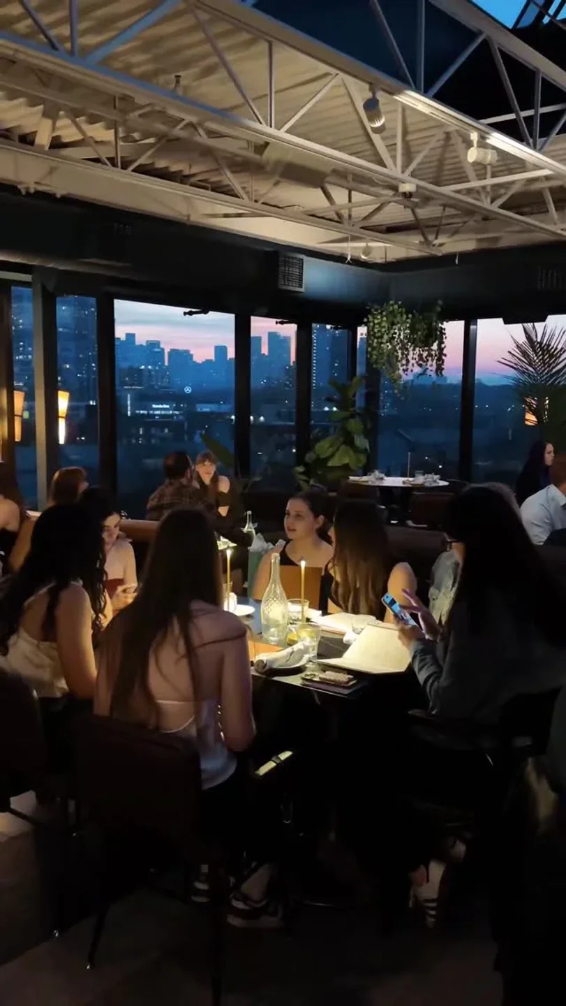 The Broadview Hotel Rooftop in Toronto offers stunning city views and a lively ambiance for diners.