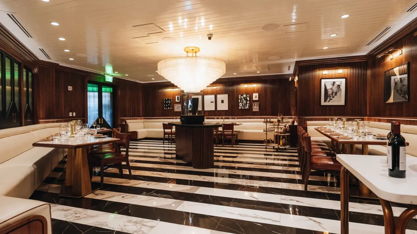Interior of The Butcher’s Club Palm Beach restaurant with black and white floor