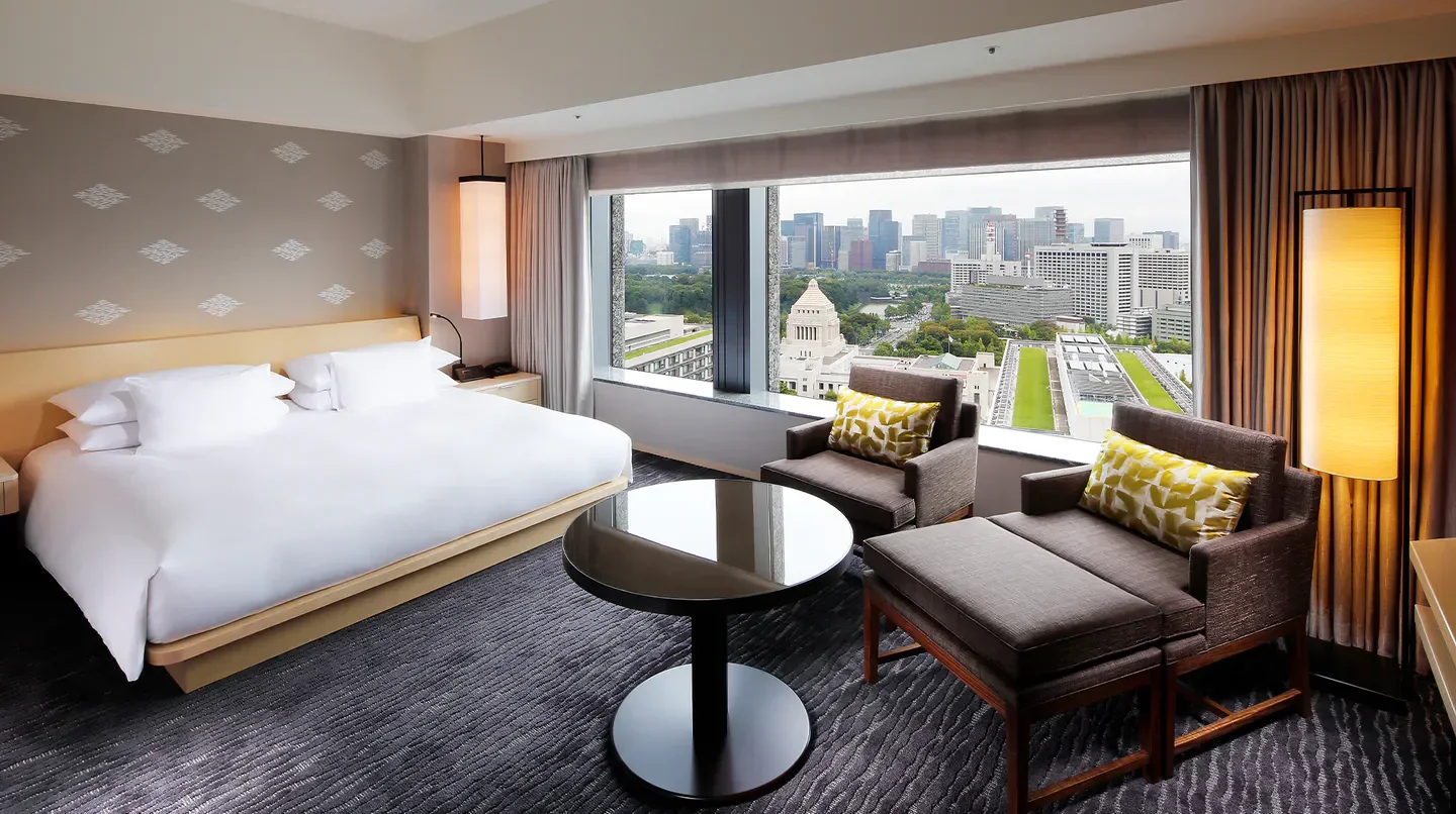 Spacious hotel room with city views at The Capitol Hotel Tokyu in Tokyo, Japan.