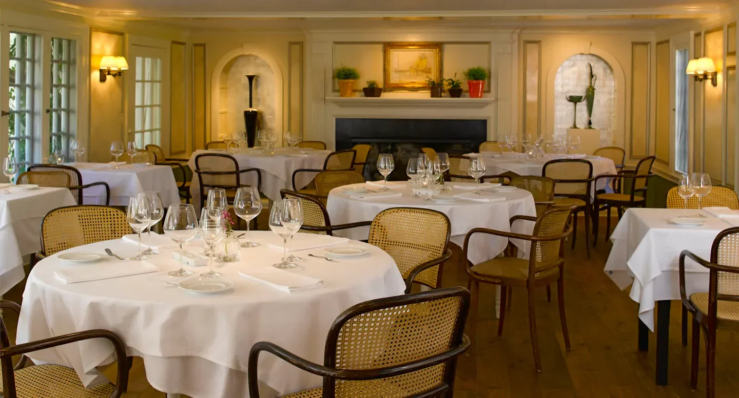 Elegant dining room interior at The Chanticleer Restaurant & Gardens in Nantucket.
