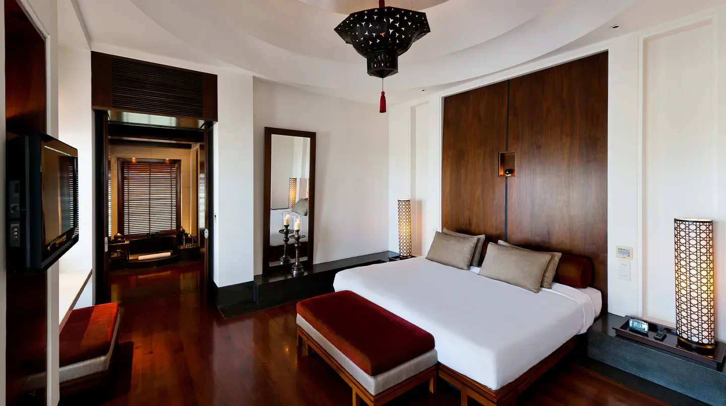 Luxury bedroom at The Chedi Muscat, Oman, featuring modern design and elegant decor.