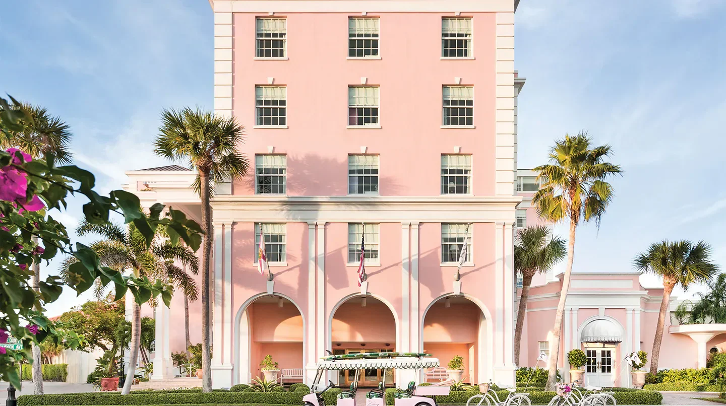 Exterior view of The Colony Hotel in Palm Beach, Florida, with pink facade
