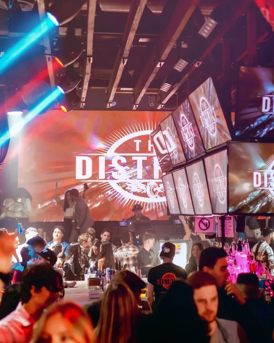 Inside The District nightclub in Scottsdale, with lights and people enjoying the atmosphere.