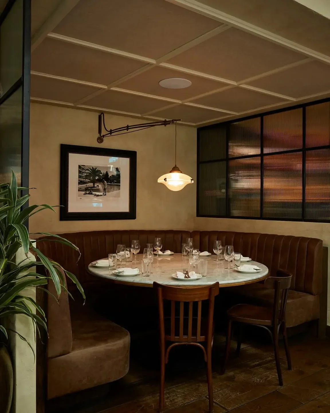 Cozy dining area at The Dry Dock in Sydney, ready for guests with round table.