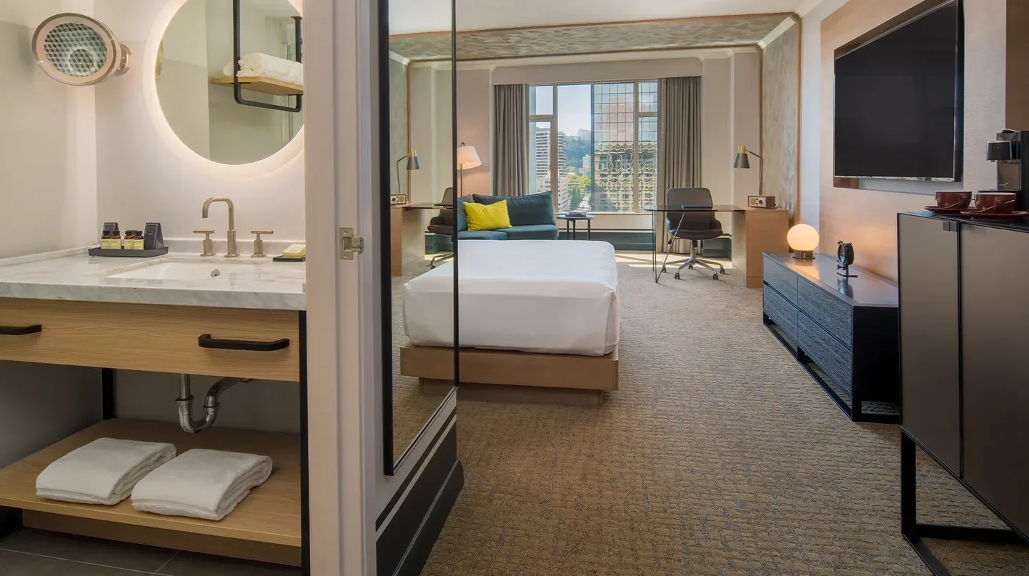 Stylish hotel room at The Duniway Portland, A Hilton Hotel in Portland, Oregon.