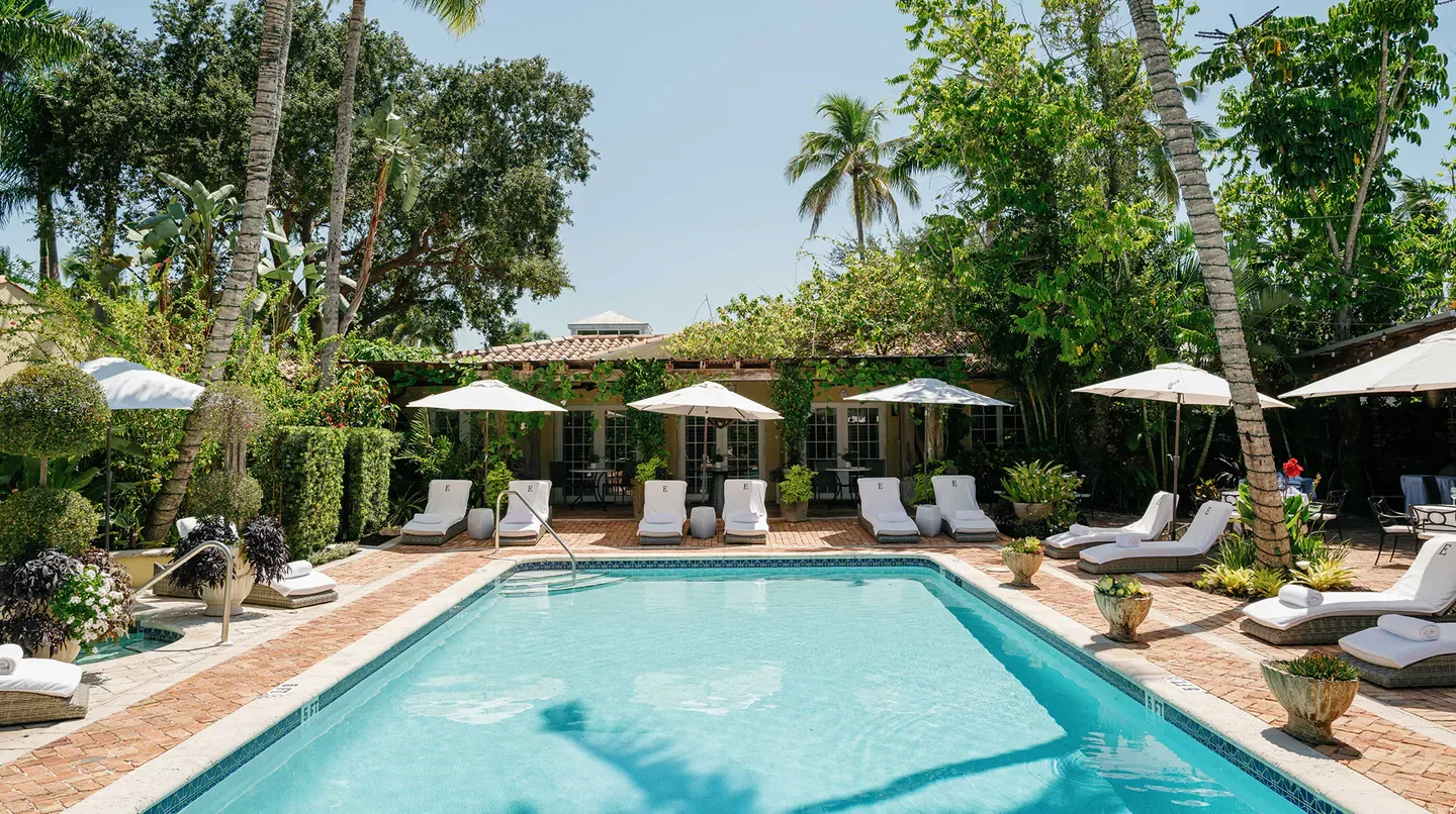 Pool and lounge chairs at The Escalante hotel in Naples Florida.