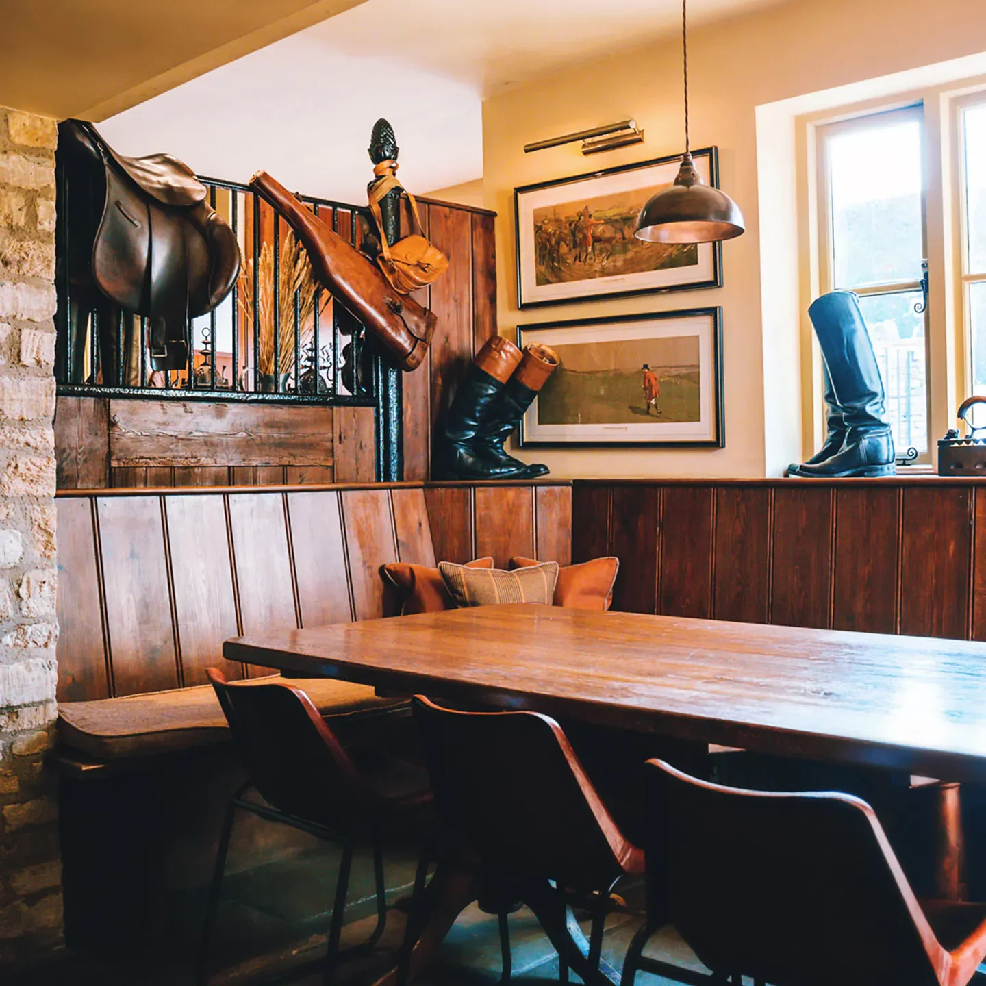 Interior of The Feathered Nest Country Inn in the Cotswolds, with rustic decor and dining table