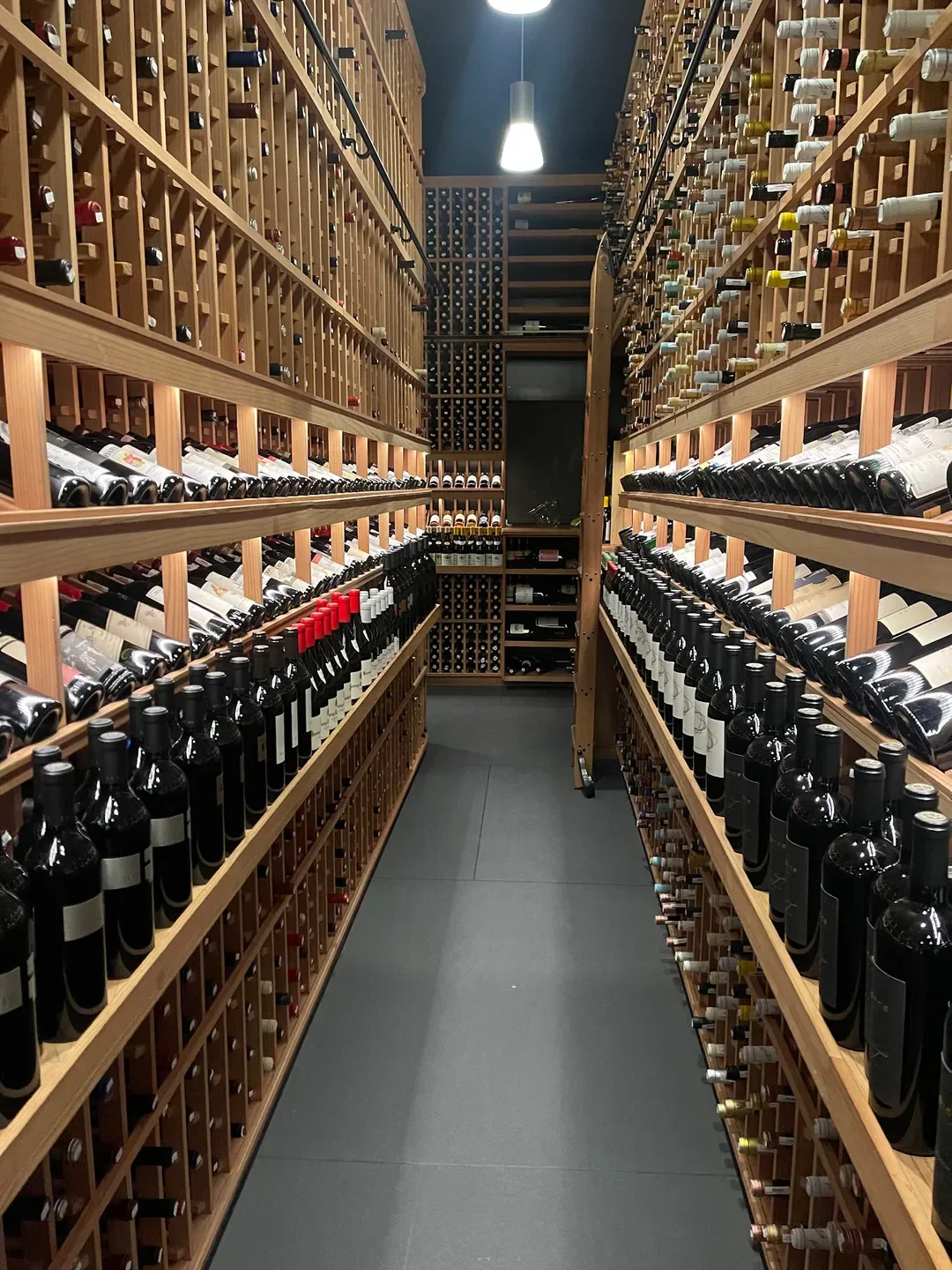 Wine cellar at The French Laundry in Napa Valley, displaying rows of fine wines.