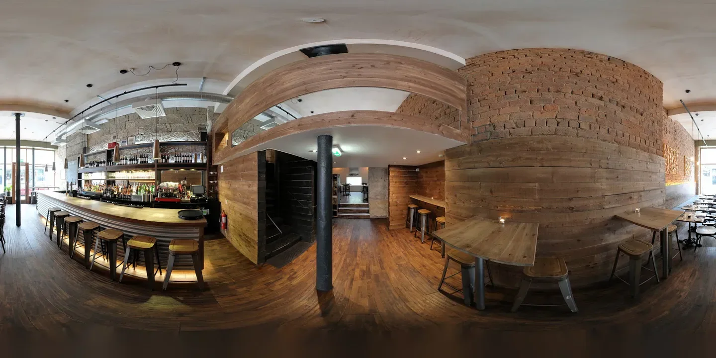 Interior view of The Gannet restaurant in Glasgow, with bar and wooden decor.