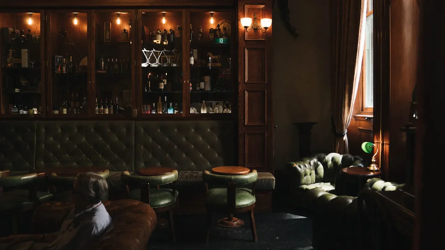 Cozy interior of The Gresham Bar in Brisbane, showcasing leather seating and classic decor.