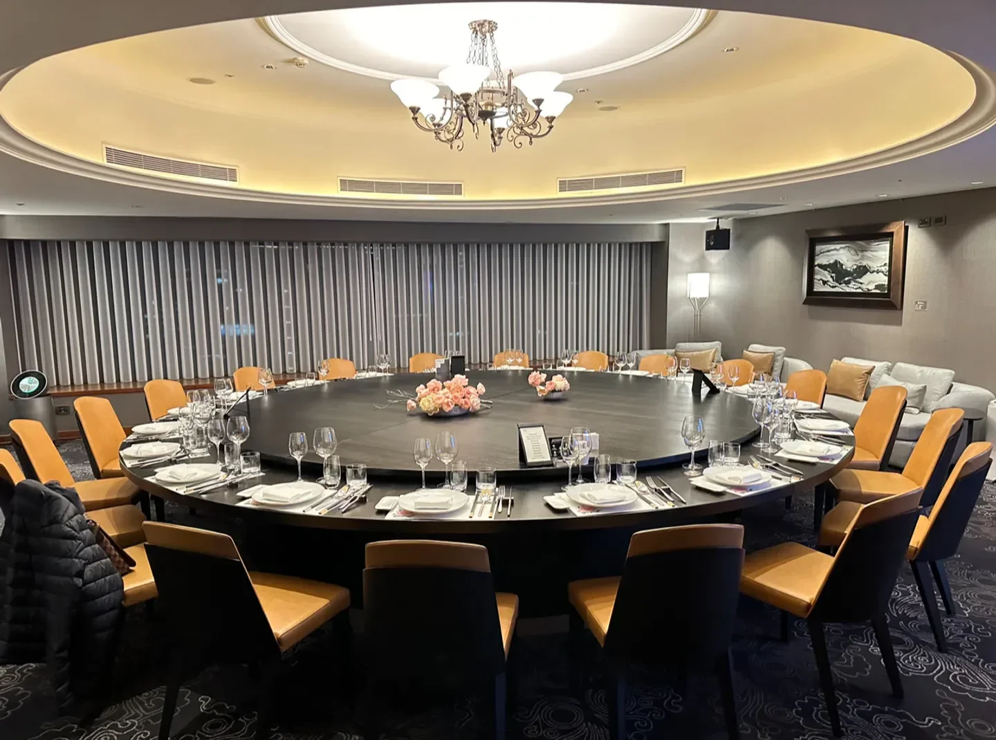Elegant round table setting at The Guest House restaurant in Taipei, perfect for fine dining.