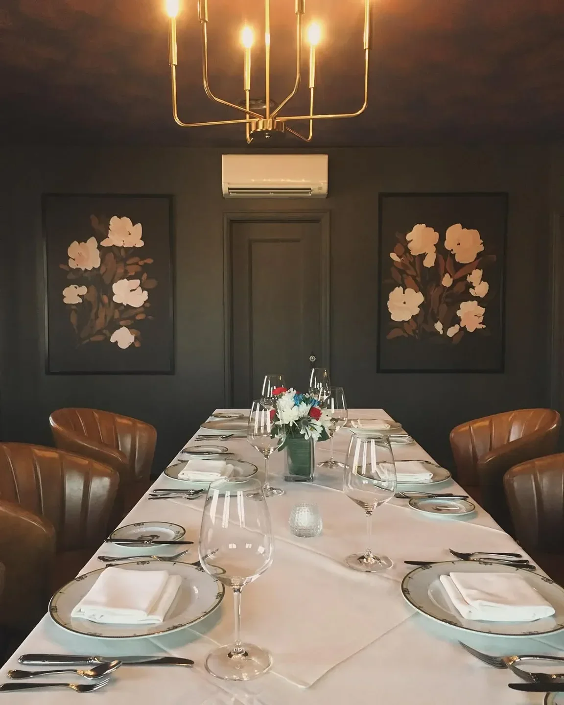 Elegant dining at The Hobbit restaurant in Orange County, featuring a flower centerpiece.