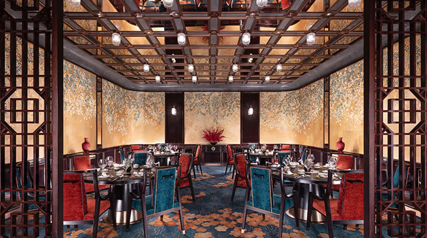 Elegant dining room interior at The Huaiyang Garden restaurant in Macau.