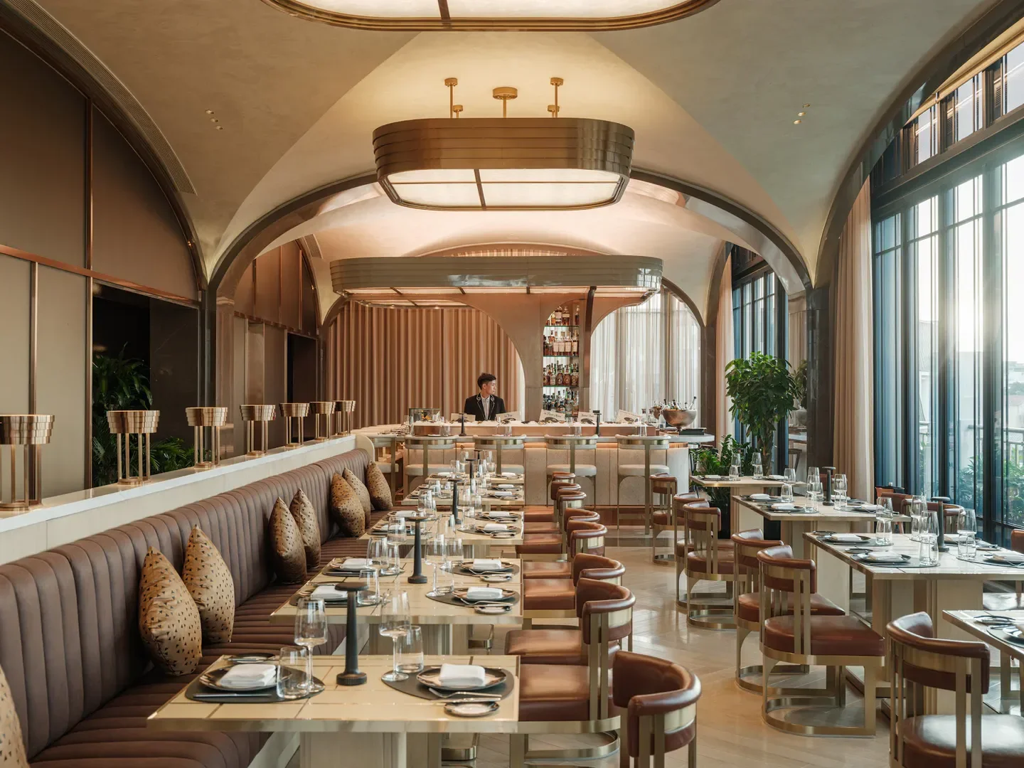 Elegant interior of The Hudson Rooms restaurant in Hanoi, with stylish seating and bar.