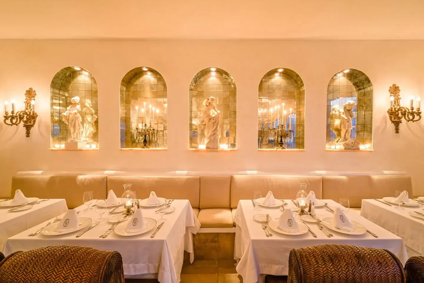 Elegant dining room at The Iguana Restaurant & Tequila Bar in Puerto Vallarta with statues.