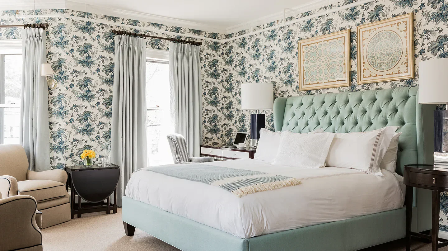 Elegant bedroom at The Inn at Hastings Park in Nantucket with floral wallpaper and large bed