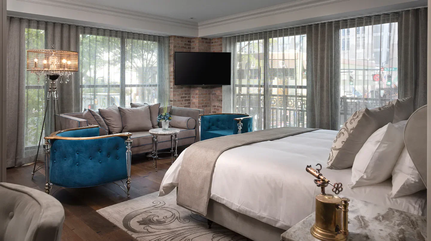 Luxury hotel suite at The Ivey's Hotel in Charlotte, with stylish furniture and design.