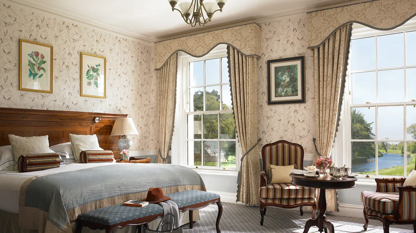 Elegant hotel room at The K Club in Dublin, with views of the river.