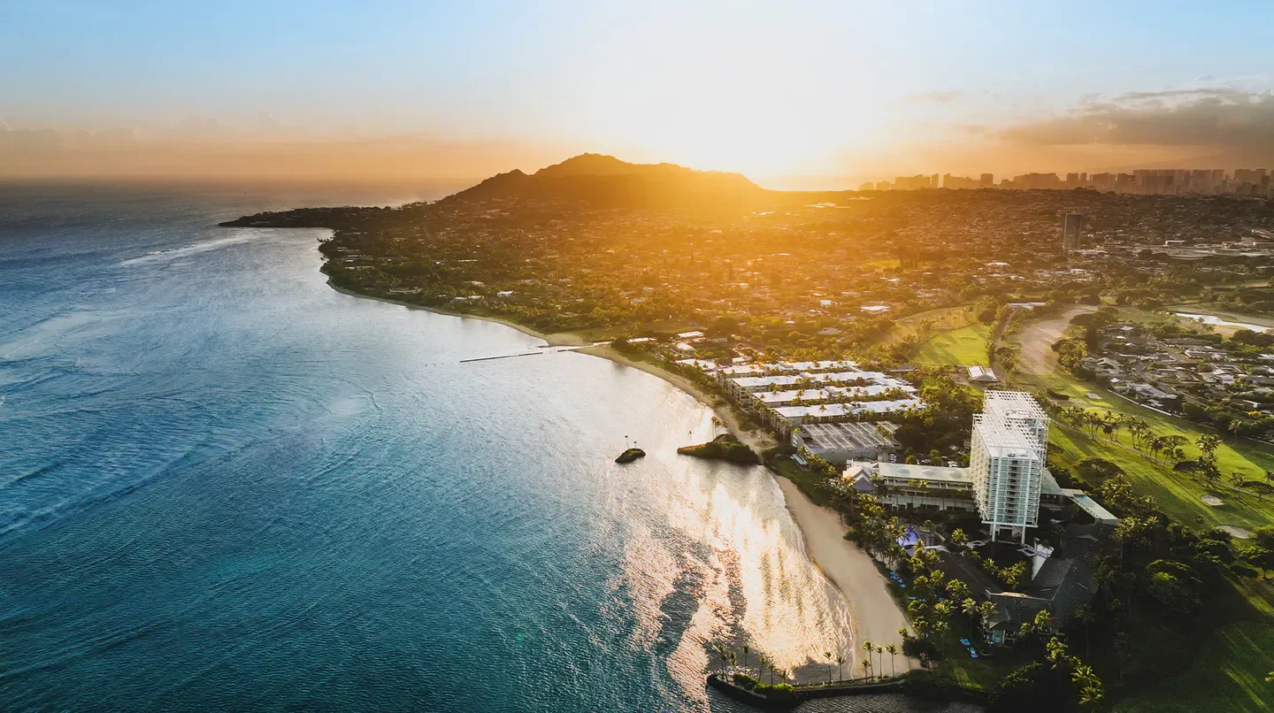 Aerial view of The Kahala Hotel and Resort on Oahu during a beautiful sunset.