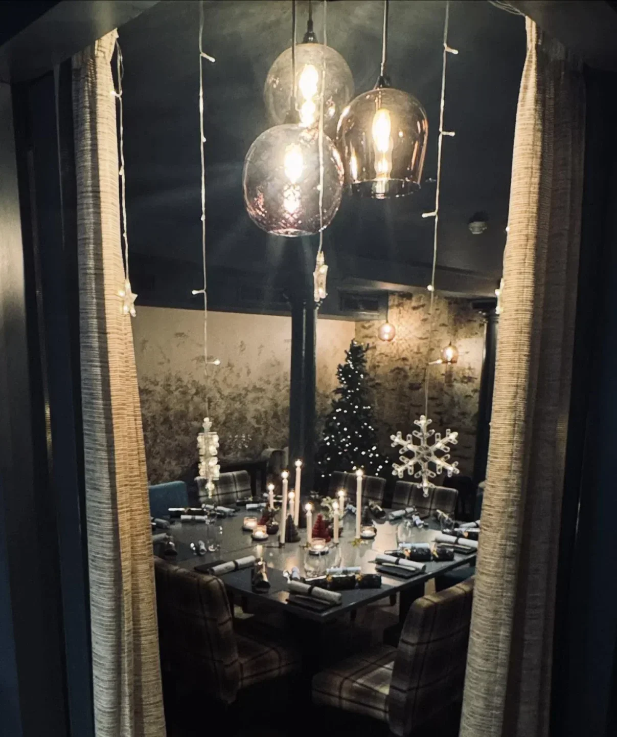 Festive dining at The Kitchin in Edinburgh, featuring Christmas decorations and ambiance.