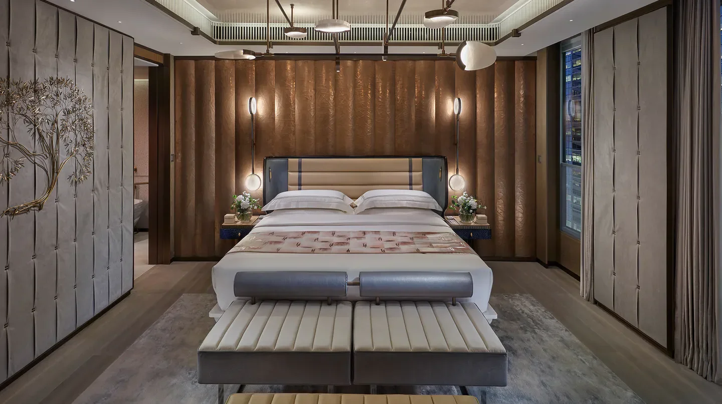 Luxury bedroom at The Landmark Mandarin Oriental, Hong Kong, with stunning city views.