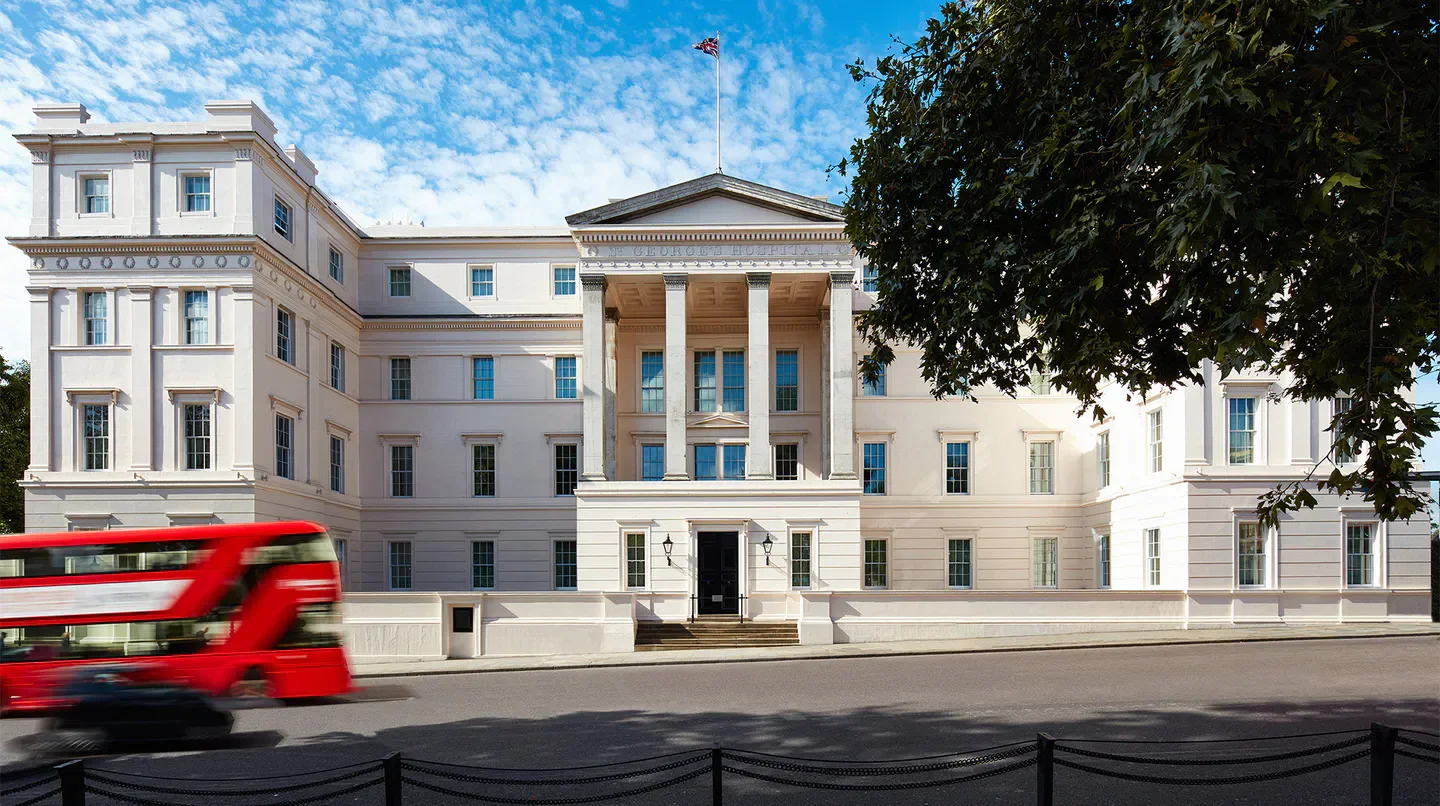 Exterior of The Lanesborough hotel in London, with red double-decker bus