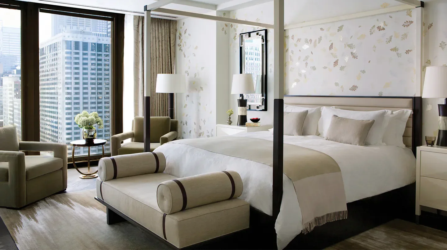 Luxury bedroom at The Langham, Chicago with city views of Chicago skyscrapers.
