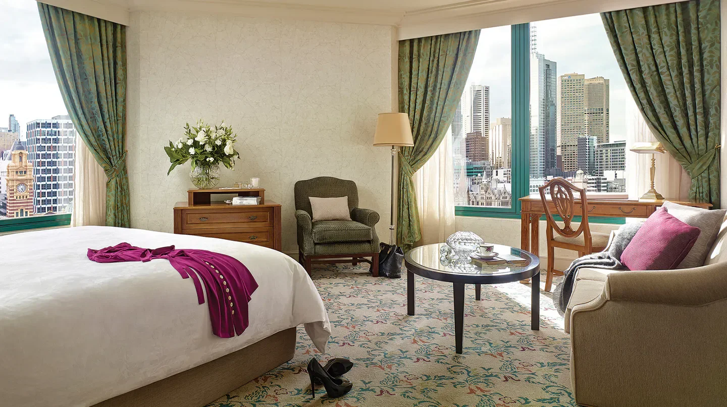 Elegant hotel room at The Langham, Melbourne, with city views overlooking Melbourne.