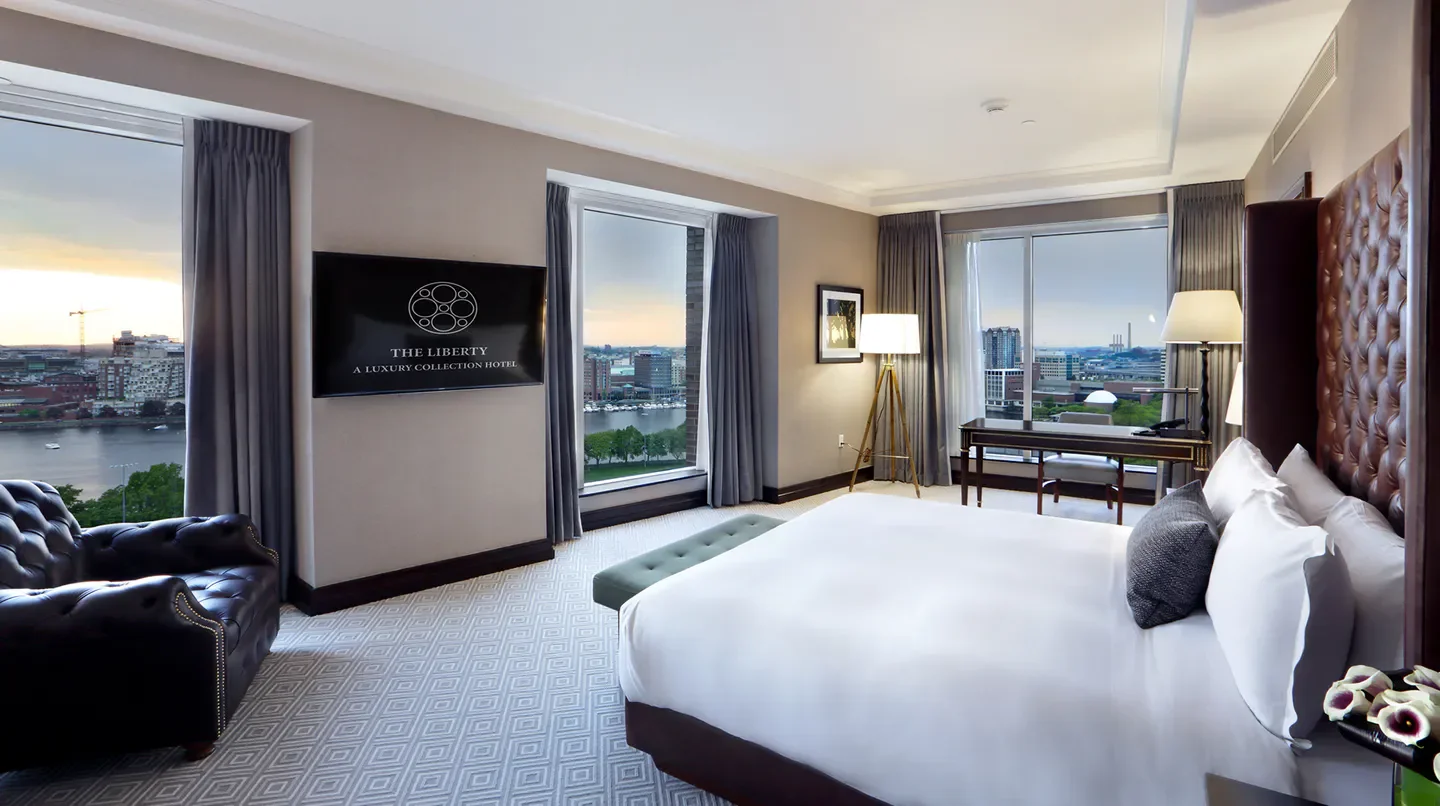 Luxury bedroom with a view at The Liberty Hotel, A Luxury Collection Hotel in Boston.