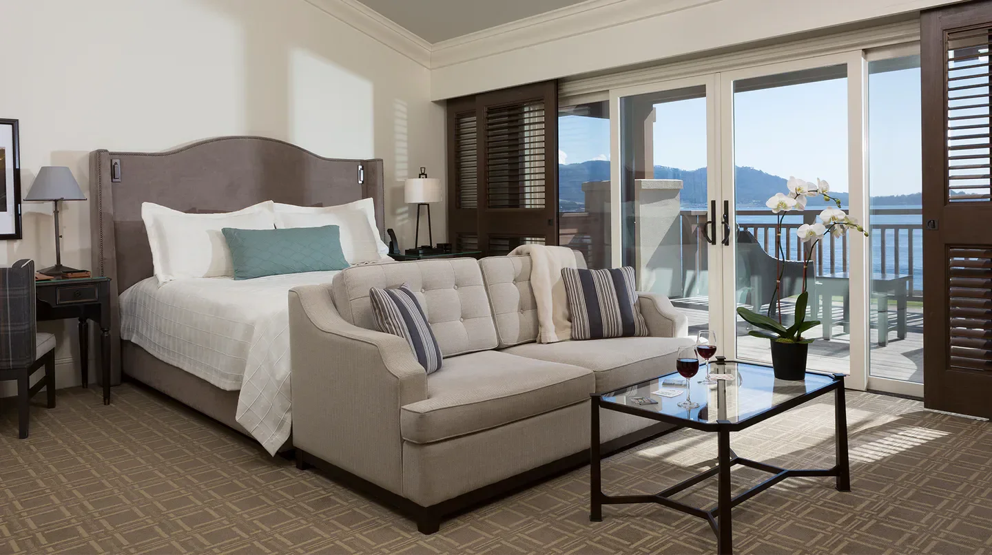 Cozy bedroom at The Lodge at Pebble Beach in Monterey, California, with ocean views.