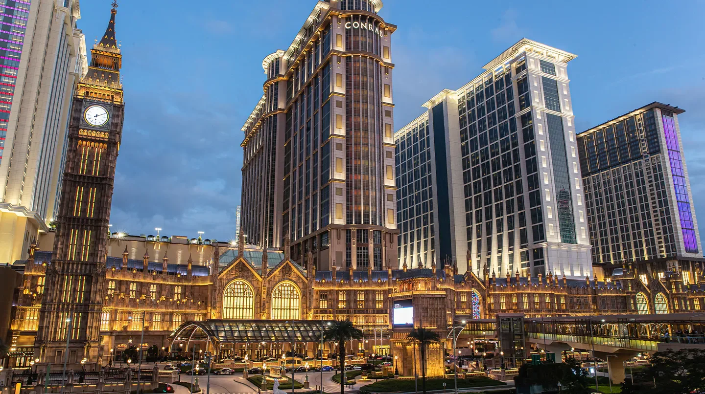 The Londoner Hotel in Macau, showcasing its illuminated architecture and iconic clock tower.