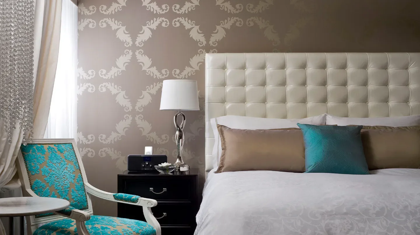 Elegant bedroom at The Nines, A Luxury Collection Hotel in Portland, featuring stylish decor.