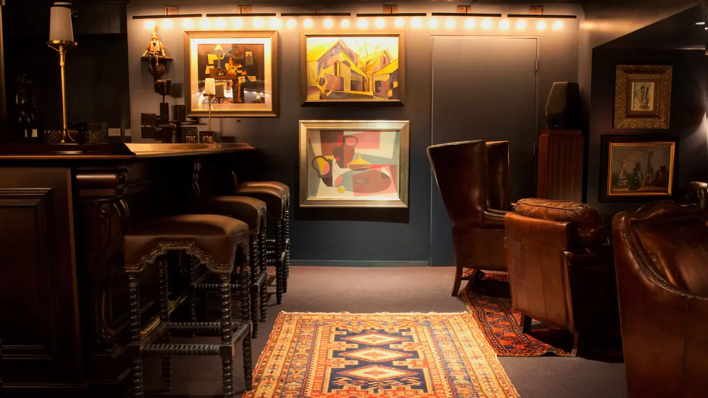 Interior of The Office in Chicago with leather stools and artwork.