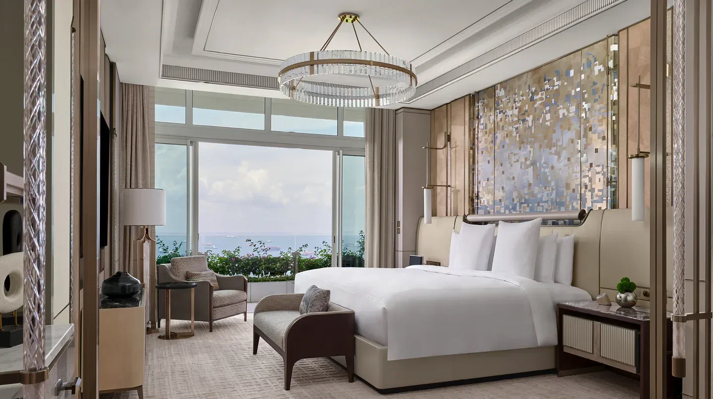 Luxury bedroom at The Paiza Collection at Marina Bay Sands, Singapore, with ocean view.
