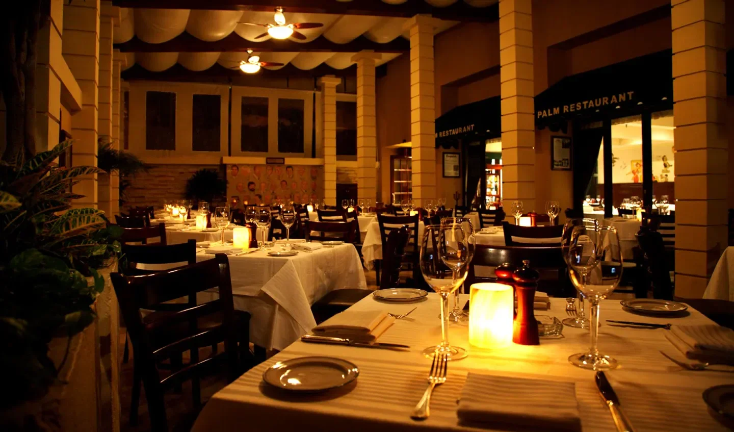 Cozy dining room at The Palm restaurant in Mexico City with tables set