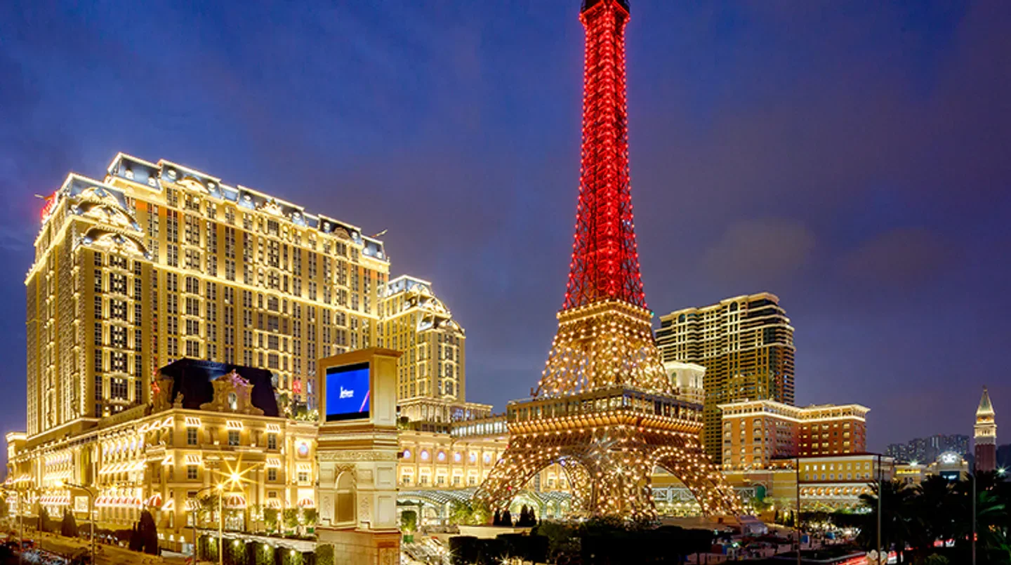 The Parisian Macao hotel in Macau with a glowing Eiffel Tower at night