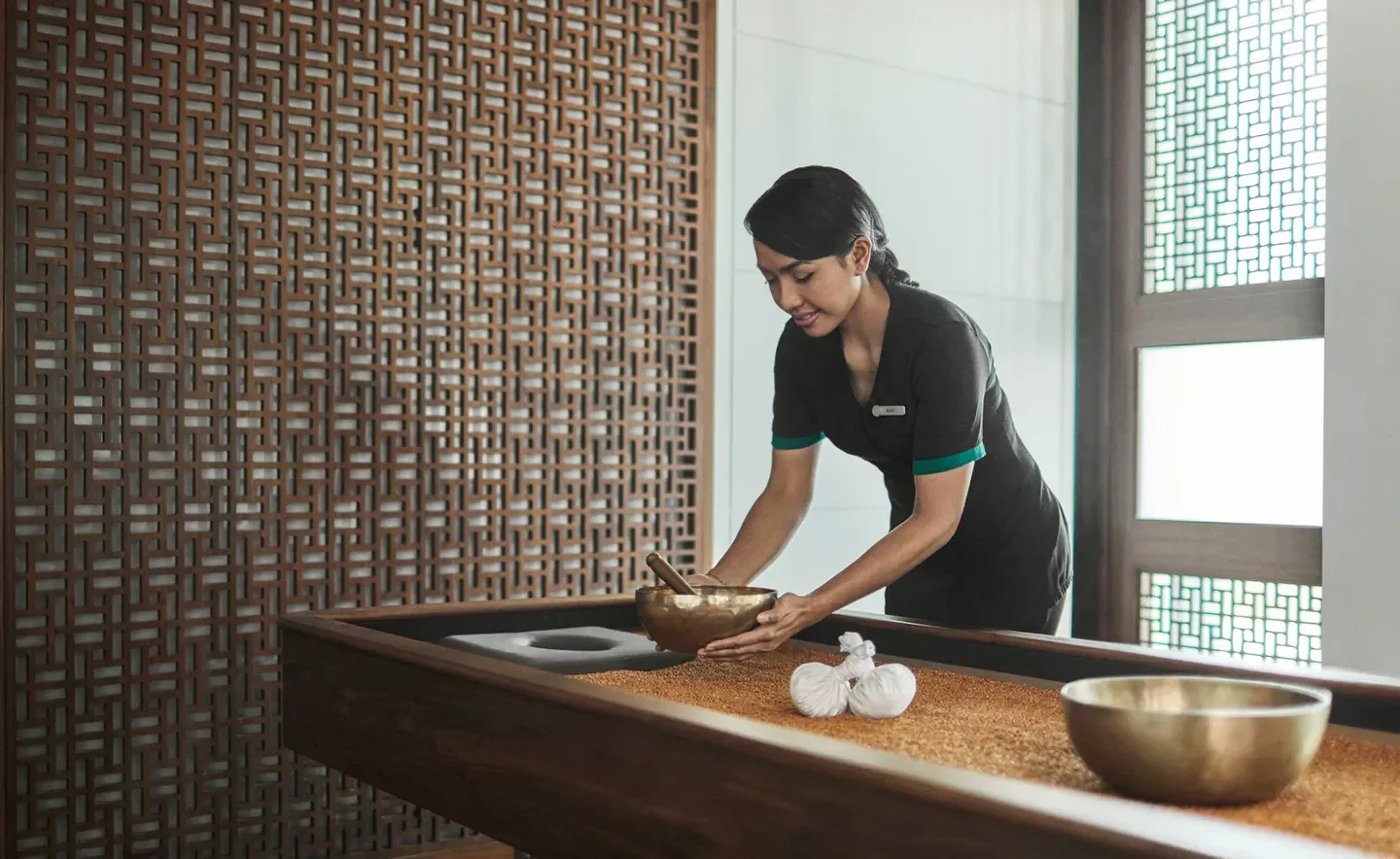 Spa treatment at The Pearl Spa and Wellness Abu Dhabi, featuring a relaxing massage setup