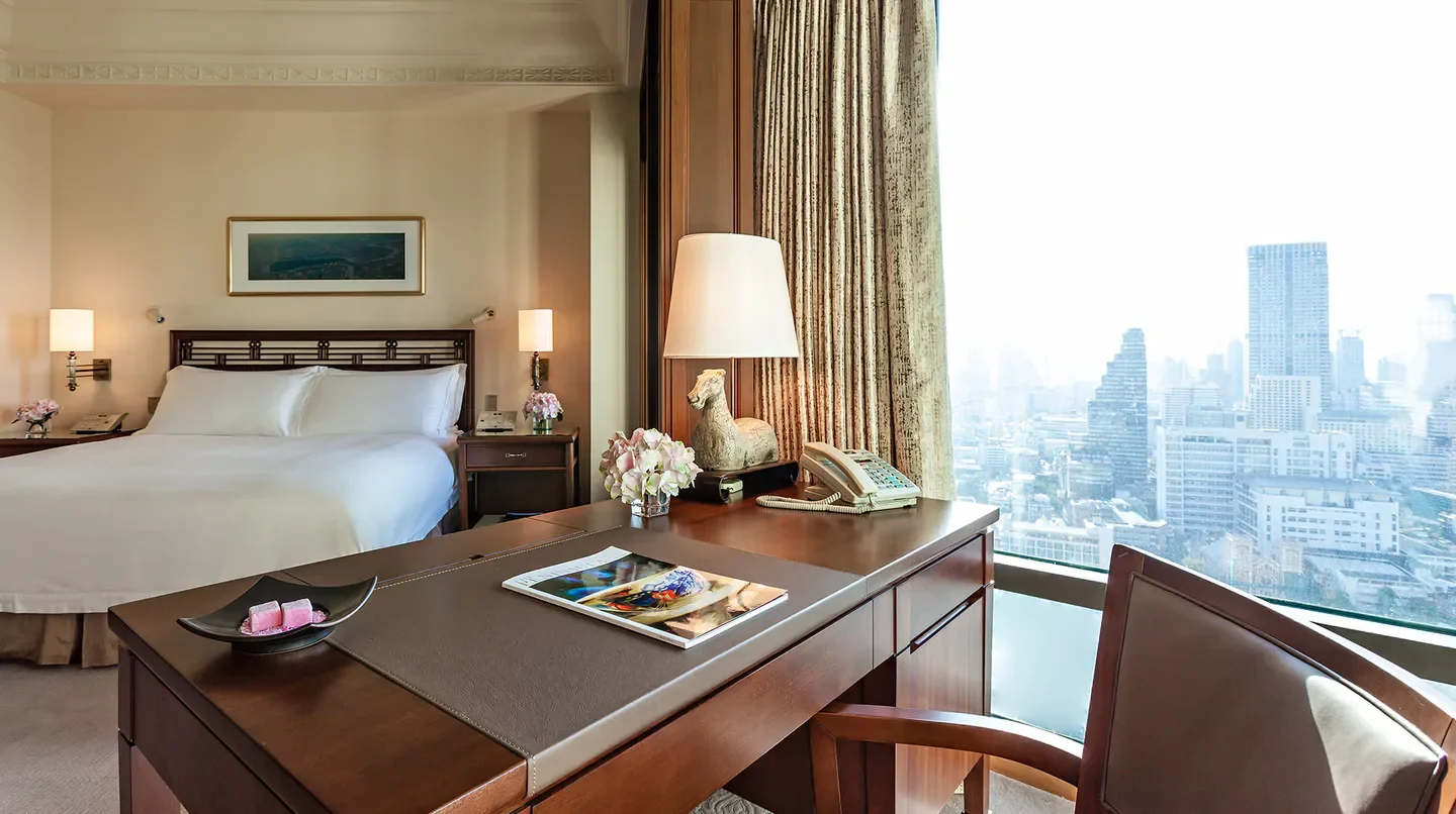 Luxury room at The Peninsula Bangkok hotel with stunning Bangkok city views.