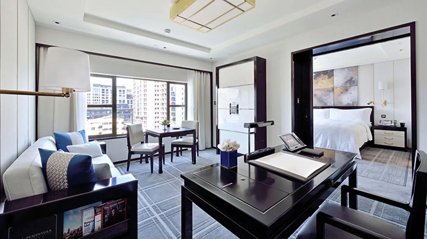 Luxury suite interior at The Peninsula Beijing hotel, featuring city views in Beijing.