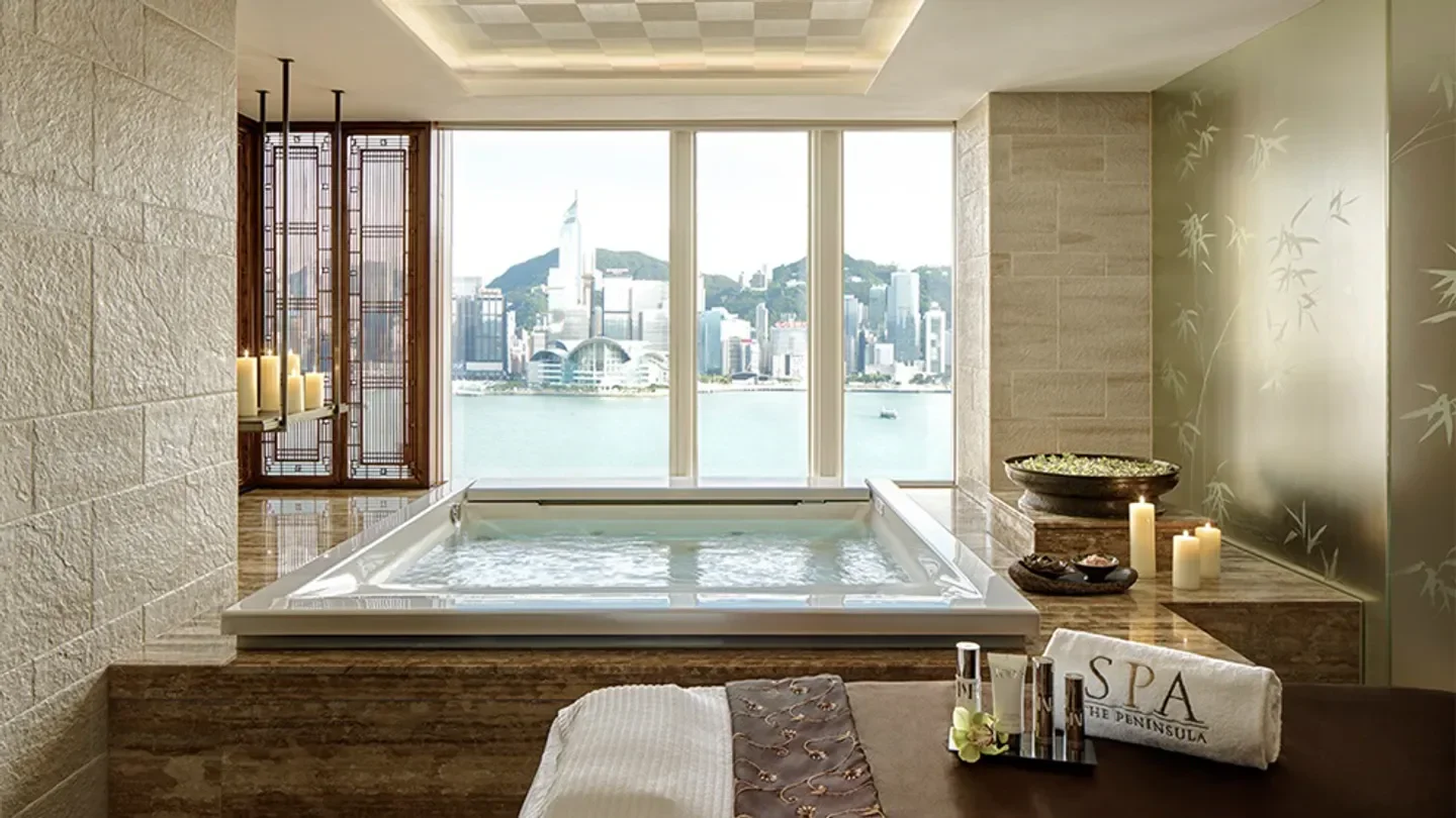 The Peninsula Spa Hong Kong spa suite overlooking the stunning Hong Kong skyline.