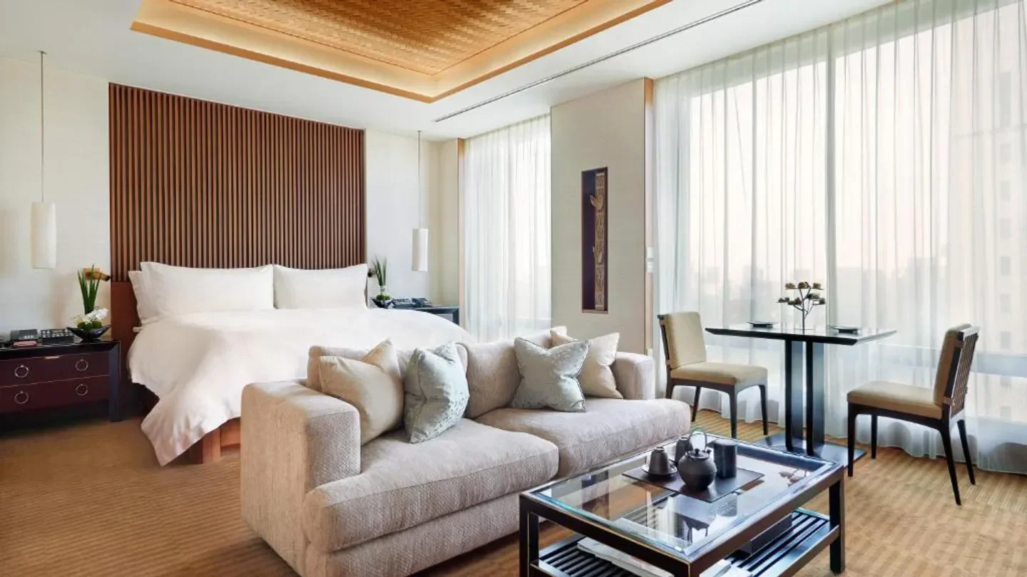 Luxury hotel room at The Peninsula Tokyo with stylish furniture and views of Tokyo.