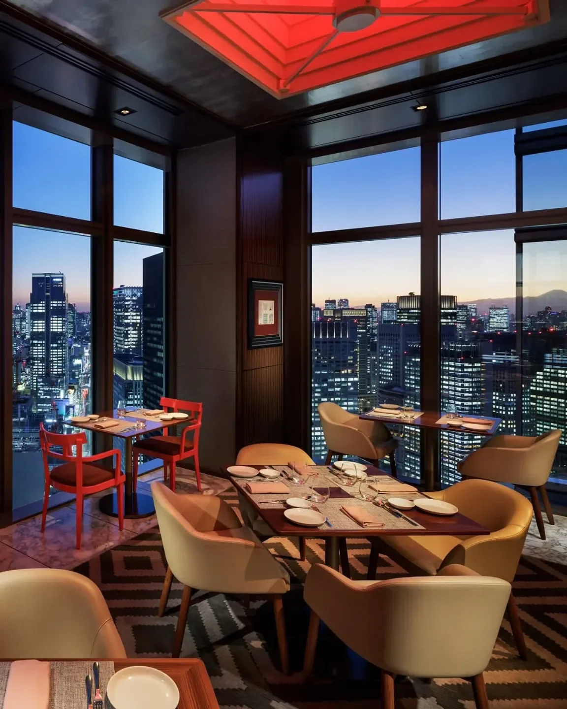 The Pizza Bar On 38th restaurant in Tokyo with a beautiful city view at dusk.
