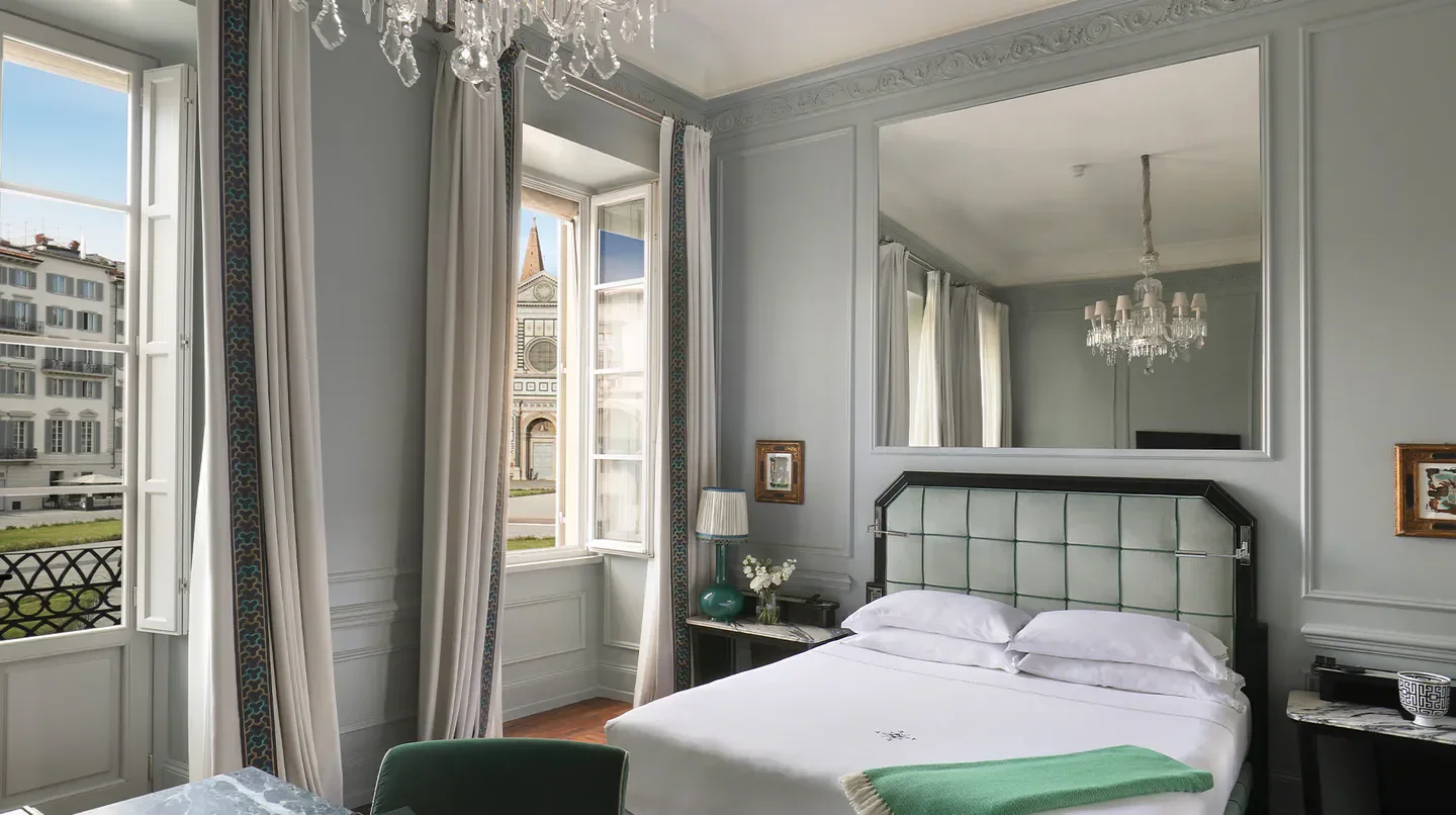 Elegant bedroom at THE PLACE Firenze with Florence cathedral view, a luxury hotel.