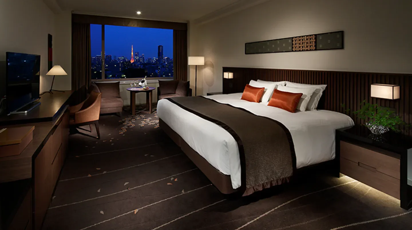 Elegant bedroom with city view at The Prince Sakura Tower Tokyo, Autograph Collection in Tokyo.