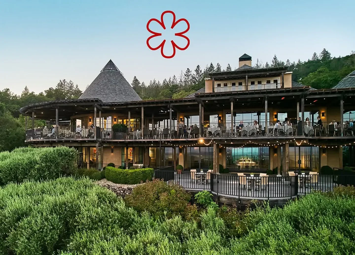 Exterior of The Restaurant at Auberge du Soleil in Napa Valley with dining terraces.
